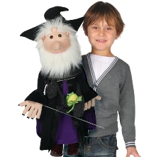 A picture of a boy holding a wizard puppet